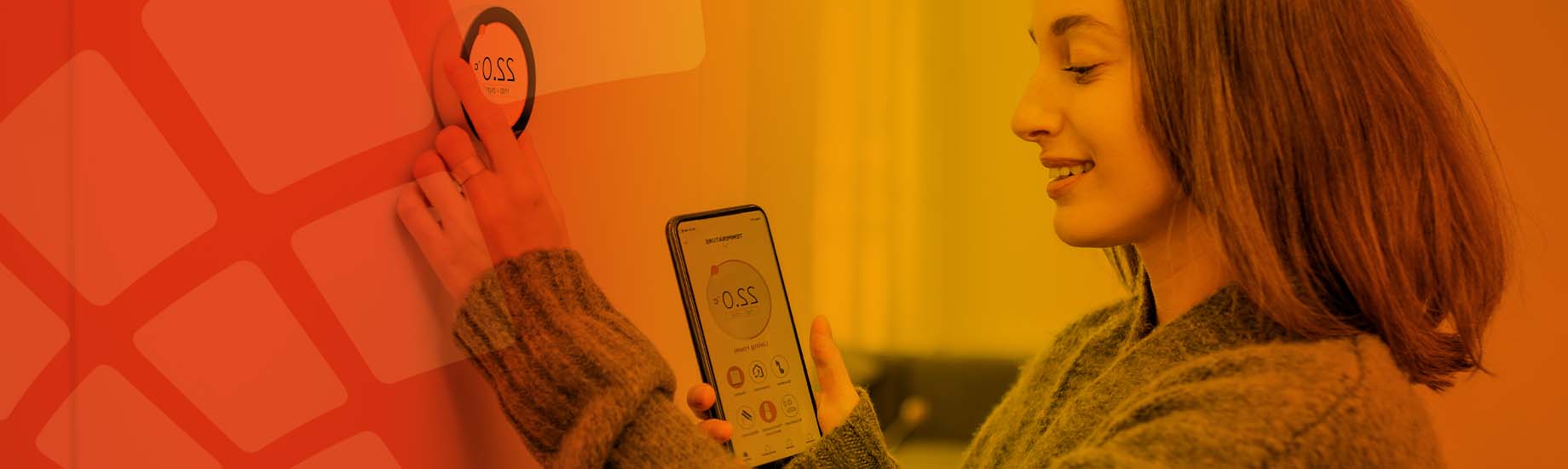 Customer smiling, using smartphone to adjust heating system
