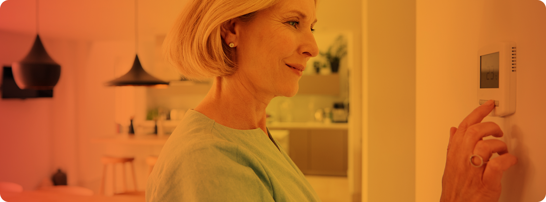Woman changing thermostat
