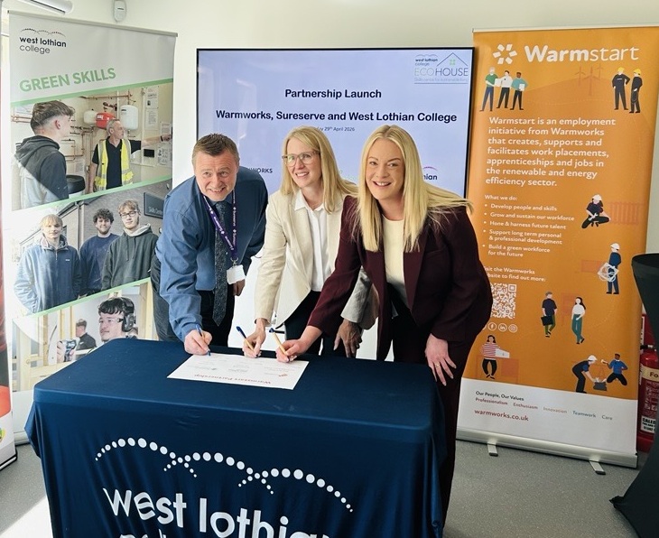 Representatives from Sureserve, West Lothian College and Warmworks signing the partnership